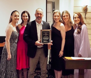 Dr. Adam Byrd is presented “Teacher of the Year” award. From left: Drs. Hannah Badon, Ruth McTighe, Adam Byrd, Teel Liddell, Laura Rezac, and Colleen Powers